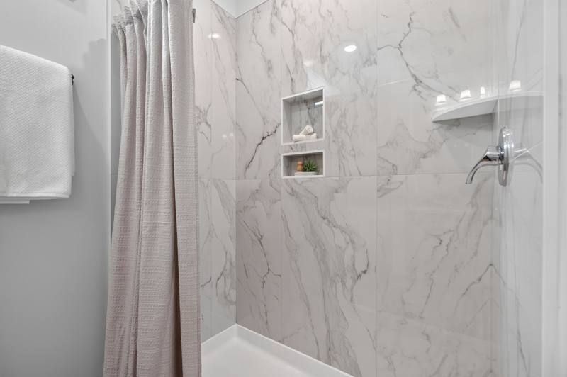 Primary Shower, furnished end unit